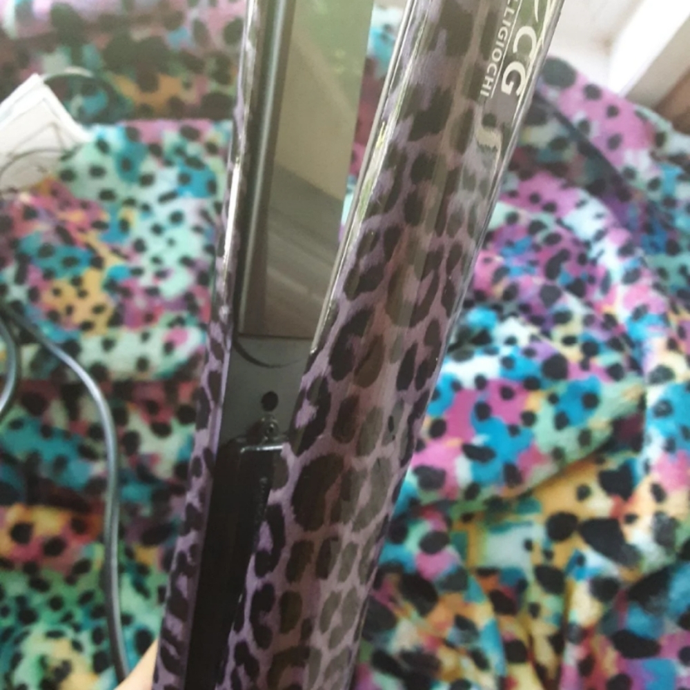 Purple and black cheetah print straightener